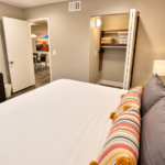 Warm Modern Bedroom with Open Closet