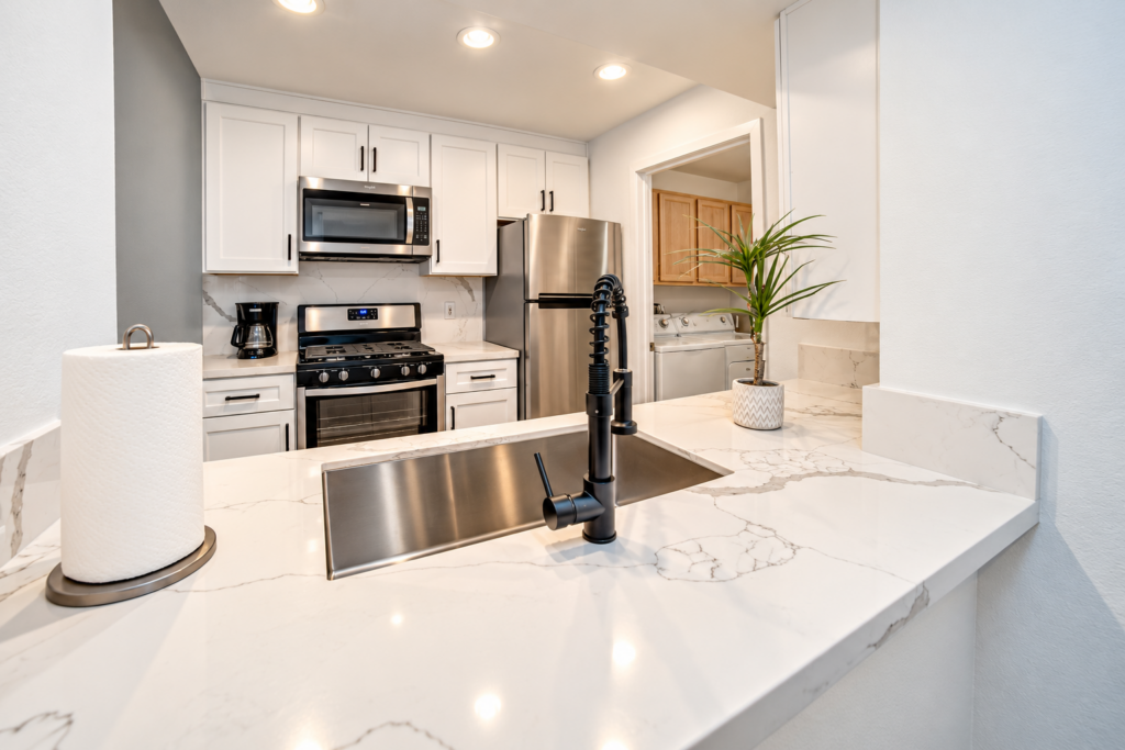 Modern White Kitchen with Marble Quartz Counters