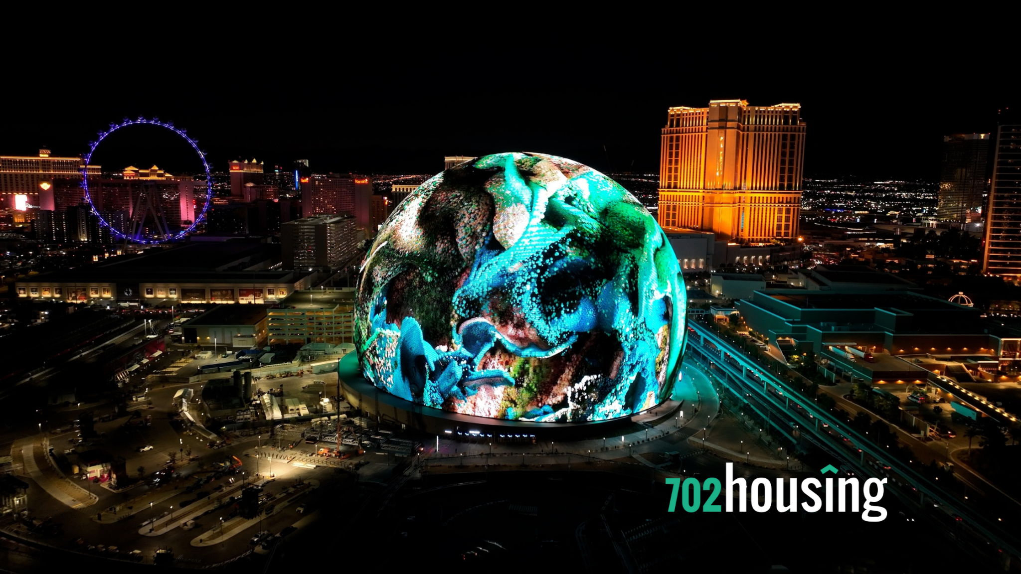 Las Vegas Strip at night with the illuminated Sphere in the forefront, showcasing the vibrant city skyline.